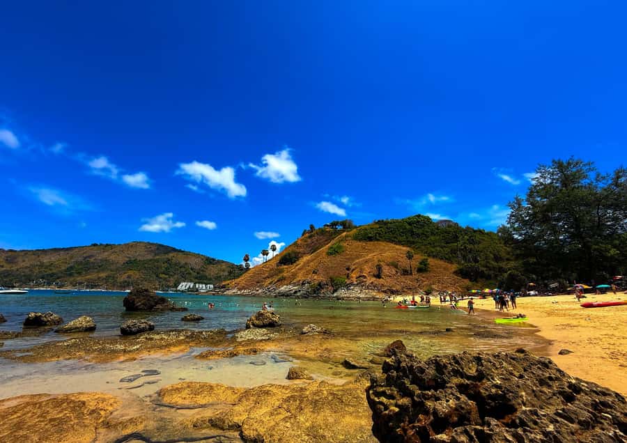 Phuket: PromthepCape,Swim Ya-Nui Beach,Buddha,Chalong Temple - Pickup, Van Ride, and How to Dress for the Heat