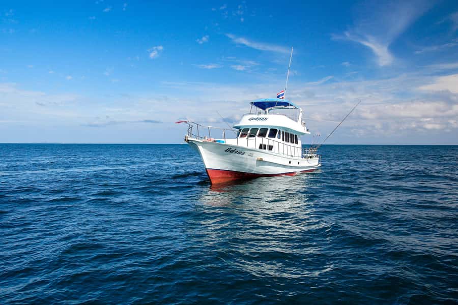 Phuket: Racha Island Fishing and Snorkeling Boat Tour - Out to Racha: trolling first, then switching into bottom fishing