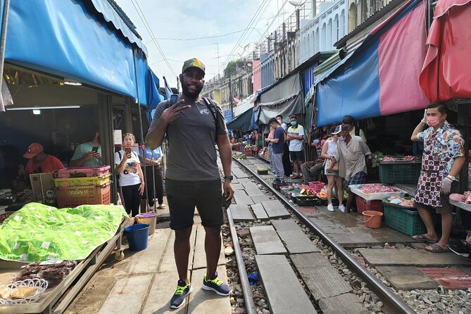 Private Amphawa & Maeklong Railway Market Day Tour with Fireflies - Mae Klong Railway Market (Hoop Rom Market): when trains interrupt shopping