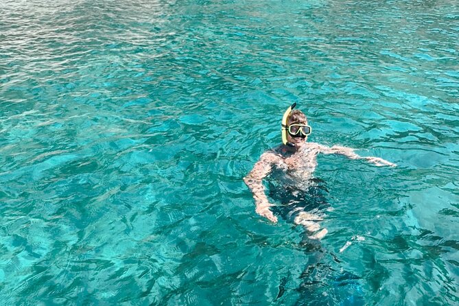 Private Boat Tour with Dolphin Spotting and Snorkelling from Phuket - Coral Island snorkelling and the Banana Beach Club beach break