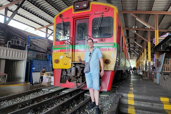 Private Maeklong Railway Market and Amphawa Day Tour from Bangkok - The Mae Klong Railway Market scene (Hoop Rom Market)