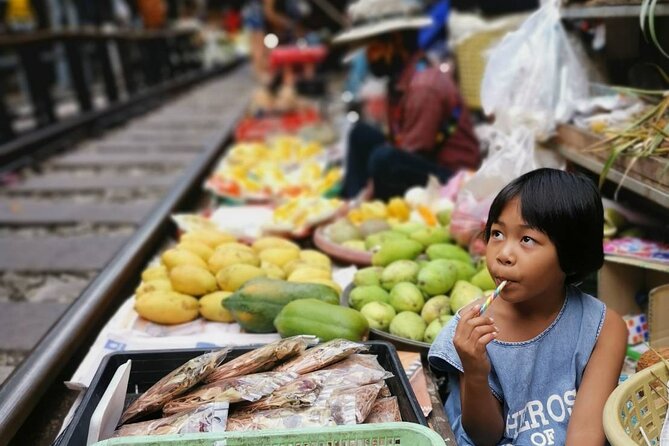 Private Tour to Railway Market and Damnoen Saduak Floating Market - A/C car, licensed guide, and travel insurance: what $125 really covers