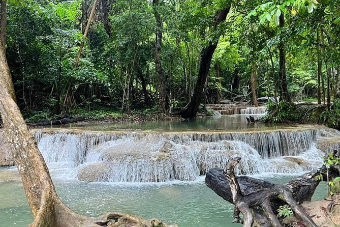 Small Group: Kanchanaburi Death Railway, Erawan Waterfall and Elephant - Tham Kra Sae cave and the Buddha statue: a short stop with strong context
