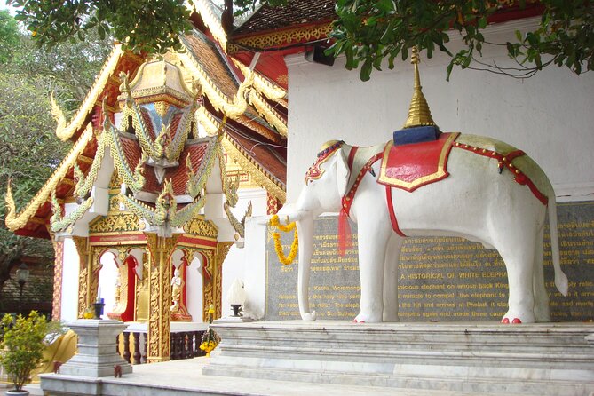 Wat Phra That Doi Suthep & Hmong Village Half Day Tour From Chiang Mai - The Hmong Village stop: clothes, culture, and questions you can ask