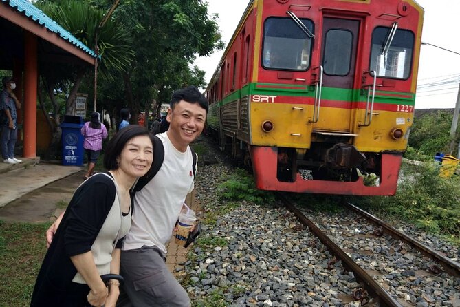 Wheelchair & Luxury Tour to Floating & Railway Markets - Mae Klong Railway Market (Hoop Rom Market): watching stalls meet the tracks