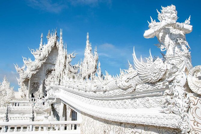 White, Red/Black and Blue Temples Full Day Trip From Chiang Mai - Wat Rong Seur Ten (Blue Temple): modern carvings in vivid blue